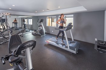 NMS-Superior-Northridge-Luxury-Apartments amenities fitness center lifestyle model exercising